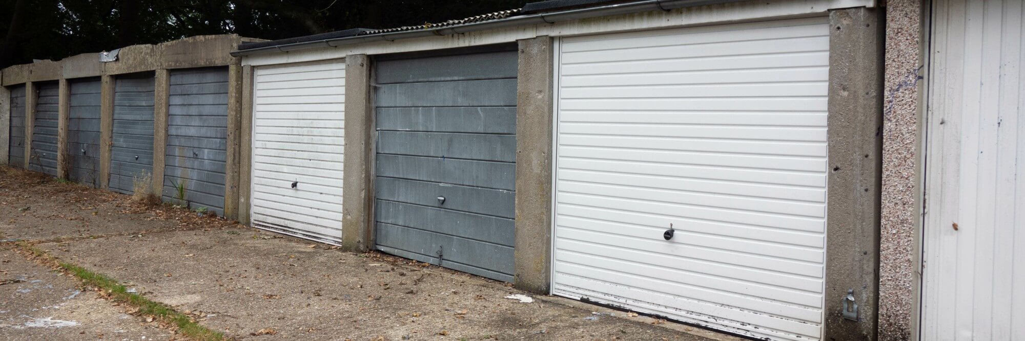 Old and damaged garage doors in need of replacement